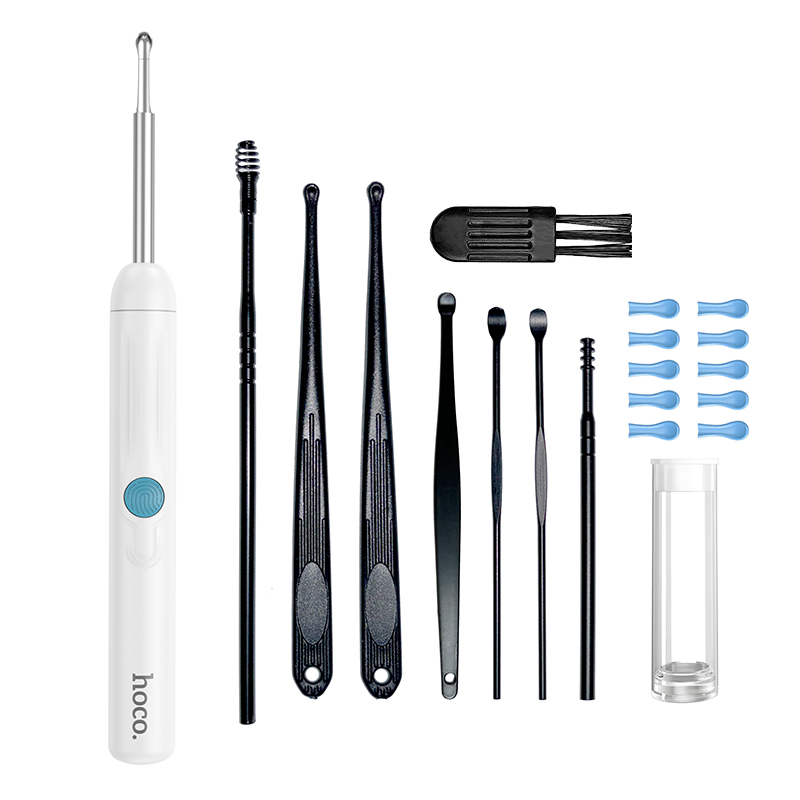 Una herramienta eléctrica blanca para quitar cerumen con curetas negras, un cepillo pequeño y accesorios azules.