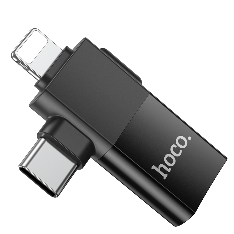 Un adaptador USB Hoco negro con conectores Lightning y USB-C.