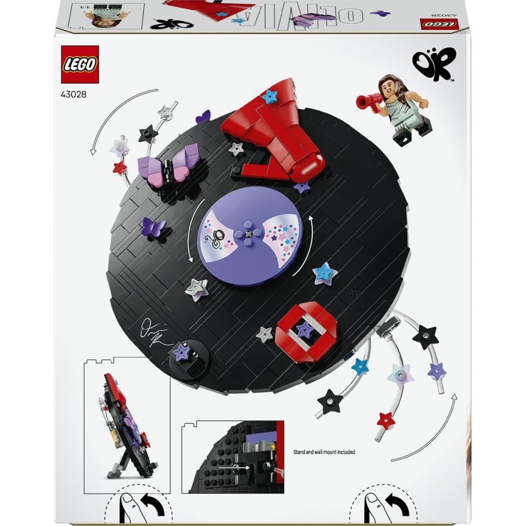 Scatola LEGO con display circolare nero, dettagli rossi e viola e piccole stelle colorate.