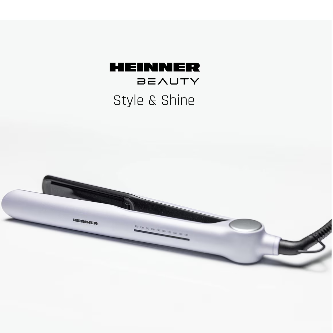 Heinner Beauty stijltang in wit en zwart met temperatuurdisplay op een witte achtergrond.