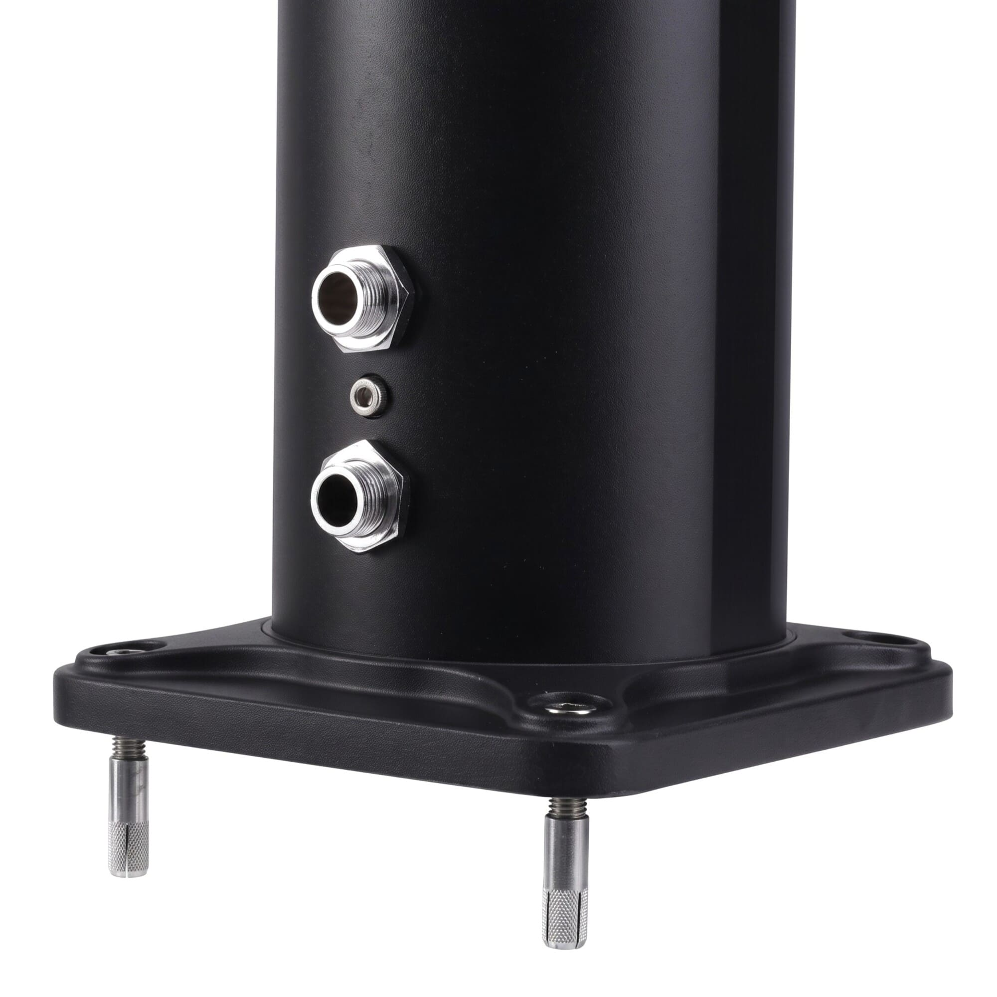 Cilindro de metal negro con dos conectores plateados sobre una base cuadrada con pernos.