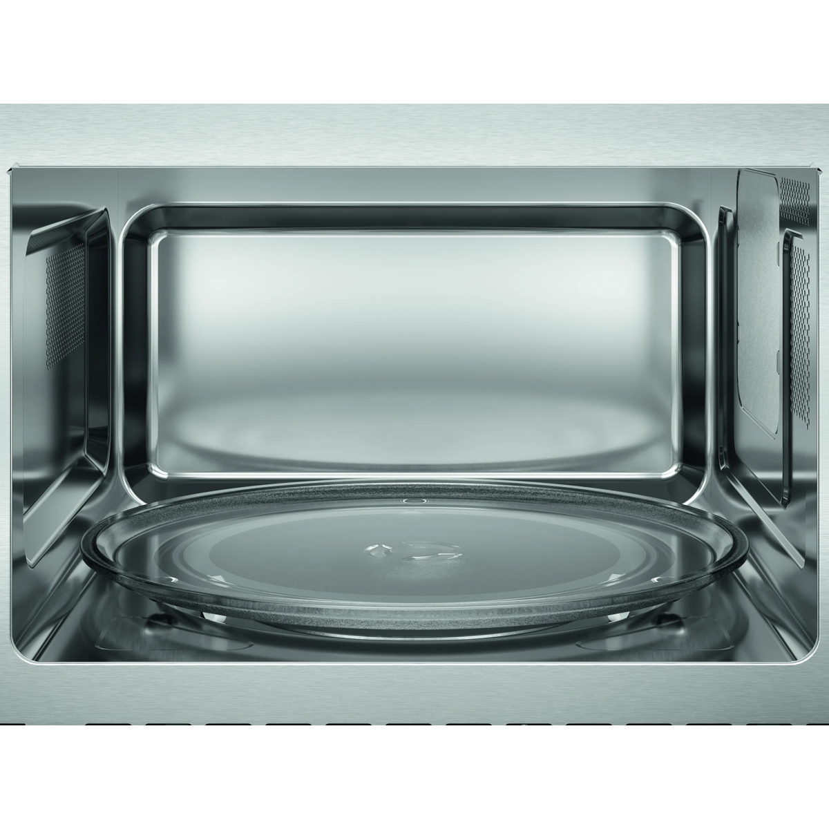 Vista interior de un microondas de acero inoxidable vacío con plato giratorio de vidrio.