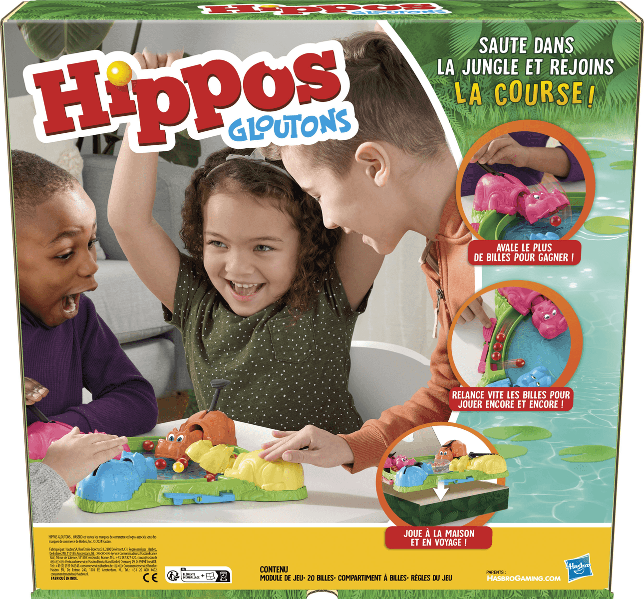 Drei glückliche Kinder spielen zusammen das bunte Brettspiel Hippos Gloutons.