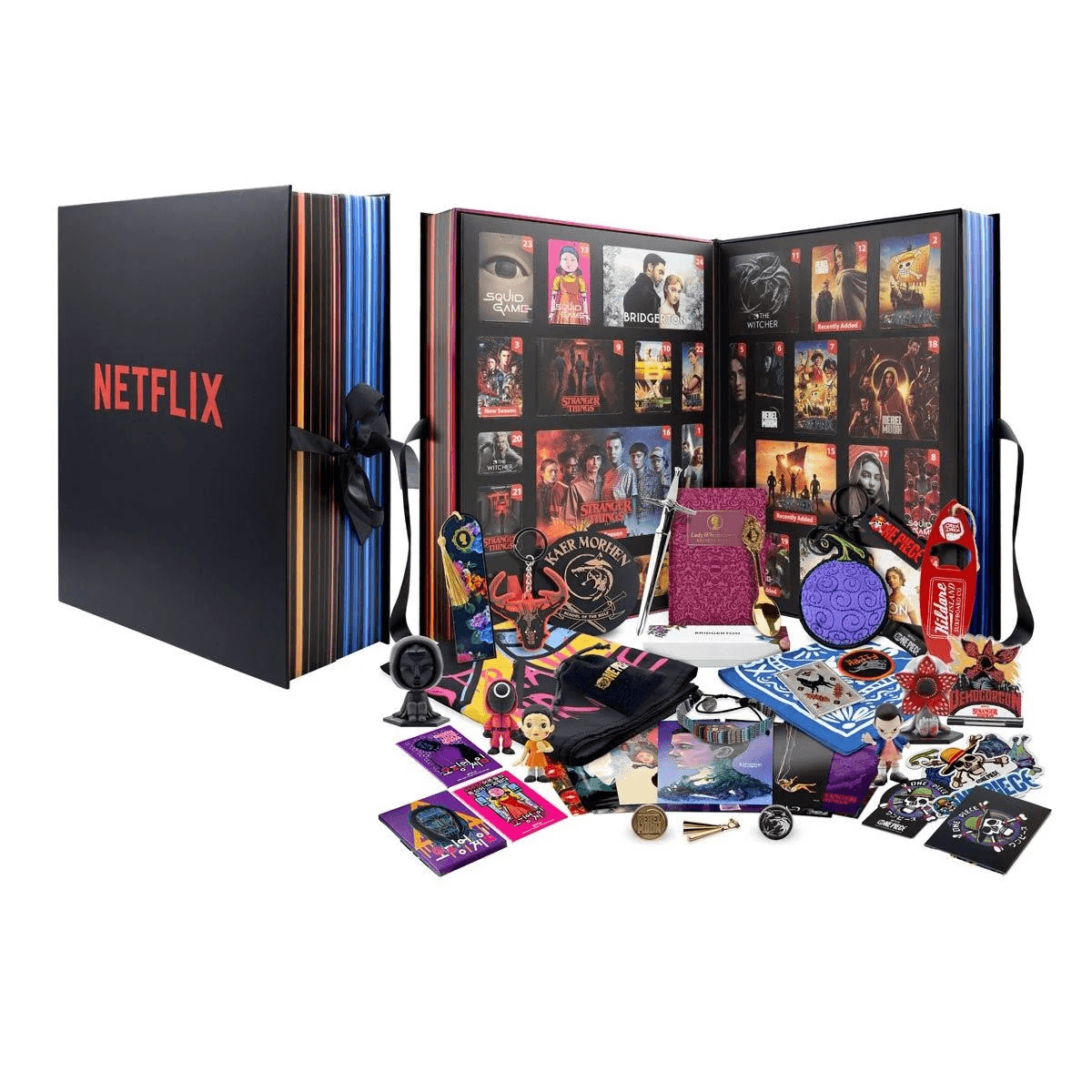 Ein großer, offener Netflix-Adventskalender mit vielen kleinen Fanartikeln, Figuren und Aufklebern davor.