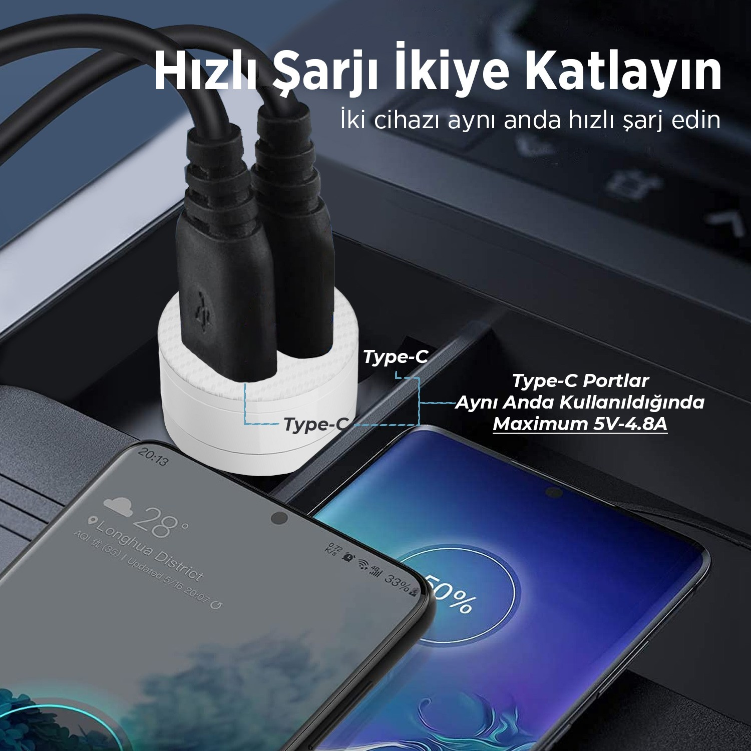 Araç konsolunda ikili Type-C şarj cihazıyla şarj olan iki akıllı telefon.