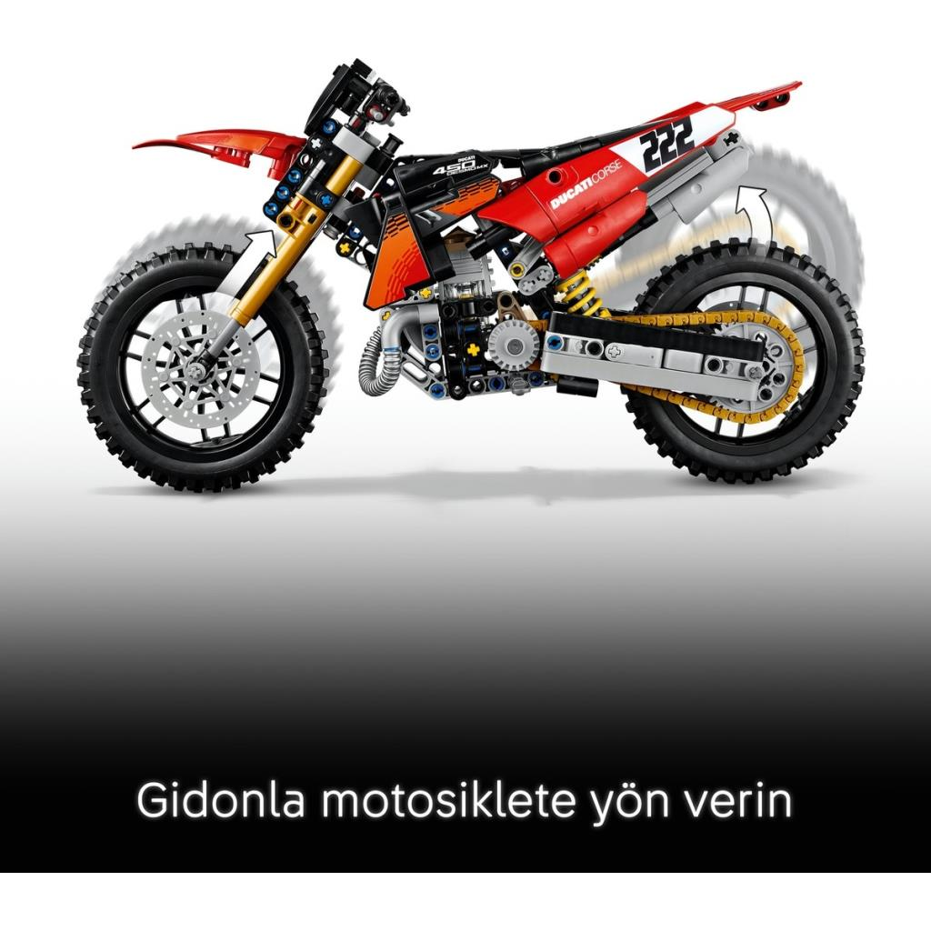 Görünür süspansiyonlu, tekerlekli ve mekanik detaylı kırmızı-siyah bir Lego Technic motosiklet modeli.