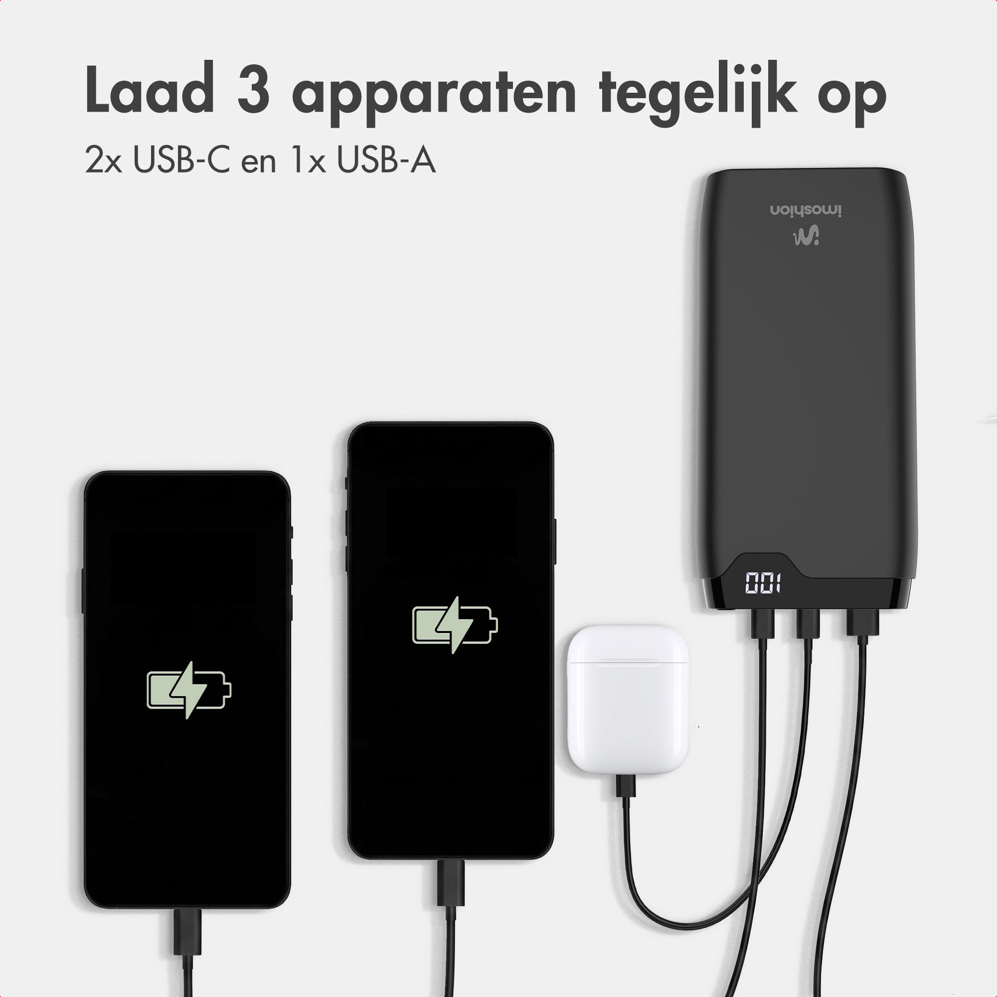 Eine schwarze Powerbank lädt gleichzeitig zwei Smartphones und ein Ladecase über USB-Kabel auf.