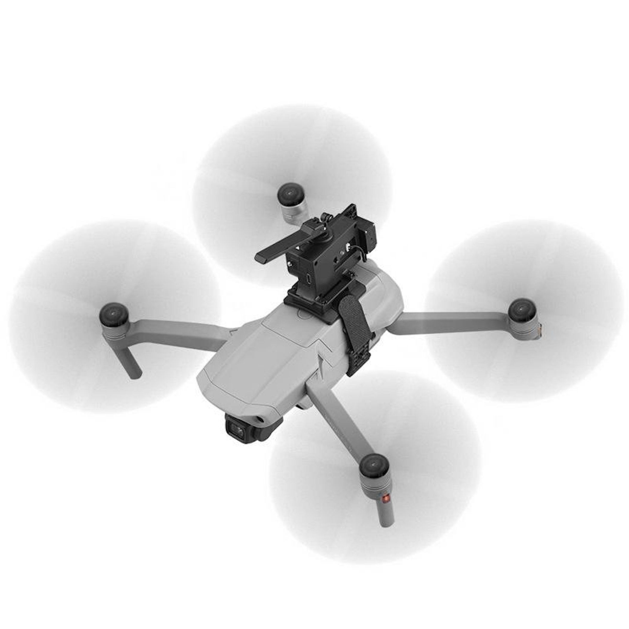 Un drone grigio con quattro eliche rotanti e un accessorio montato sulla parte superiore, su sfondo bianco.