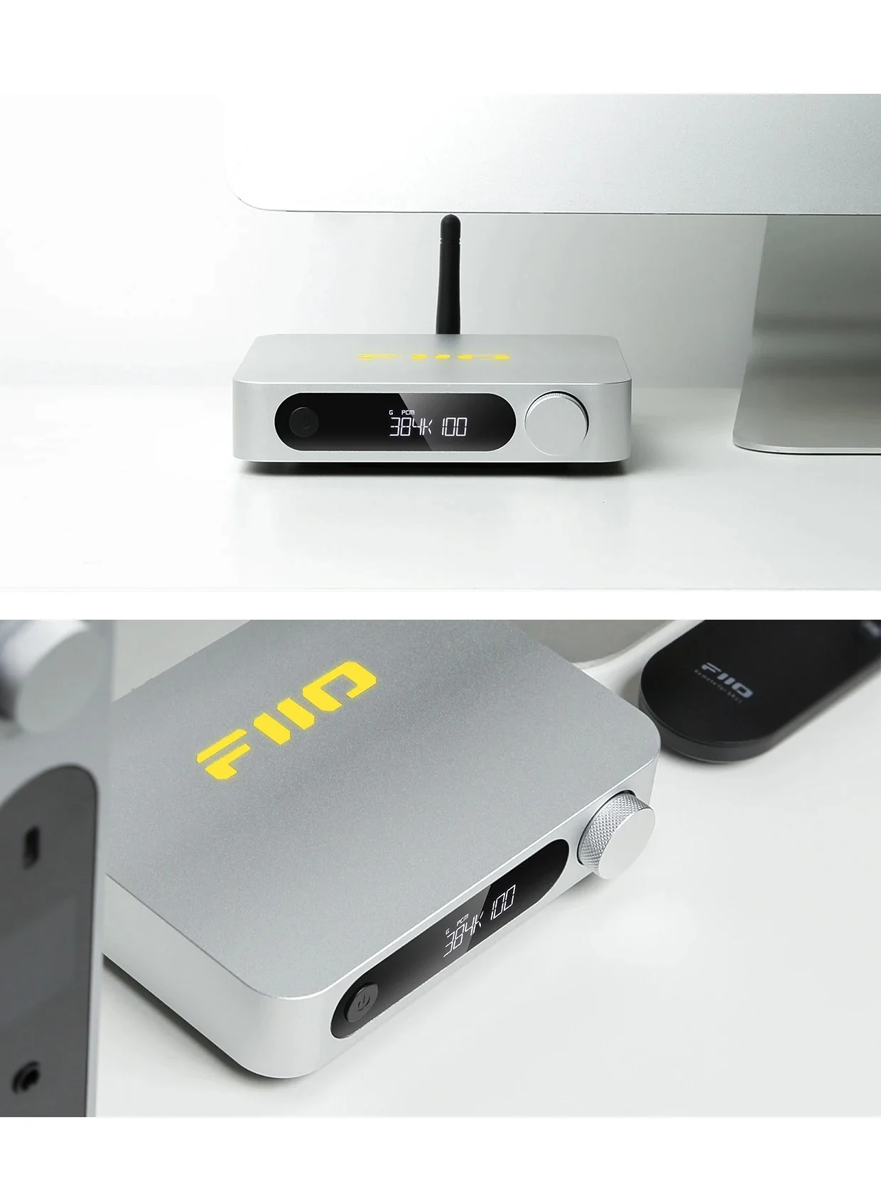 Un dispositivo de audio Fiio plateado con pantalla digital y perilla de control descansa en un escritorio blanco.