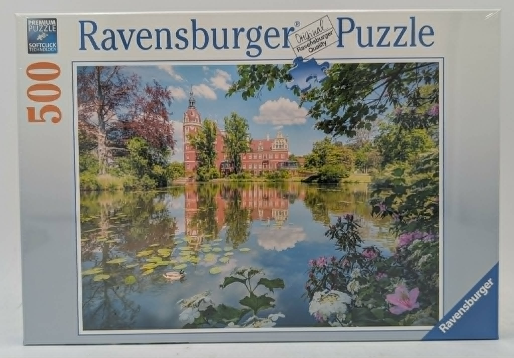 Ravensburger Puzzle mit 500 Teilen zeigt ein Schloss an einem See mit Seerosen.