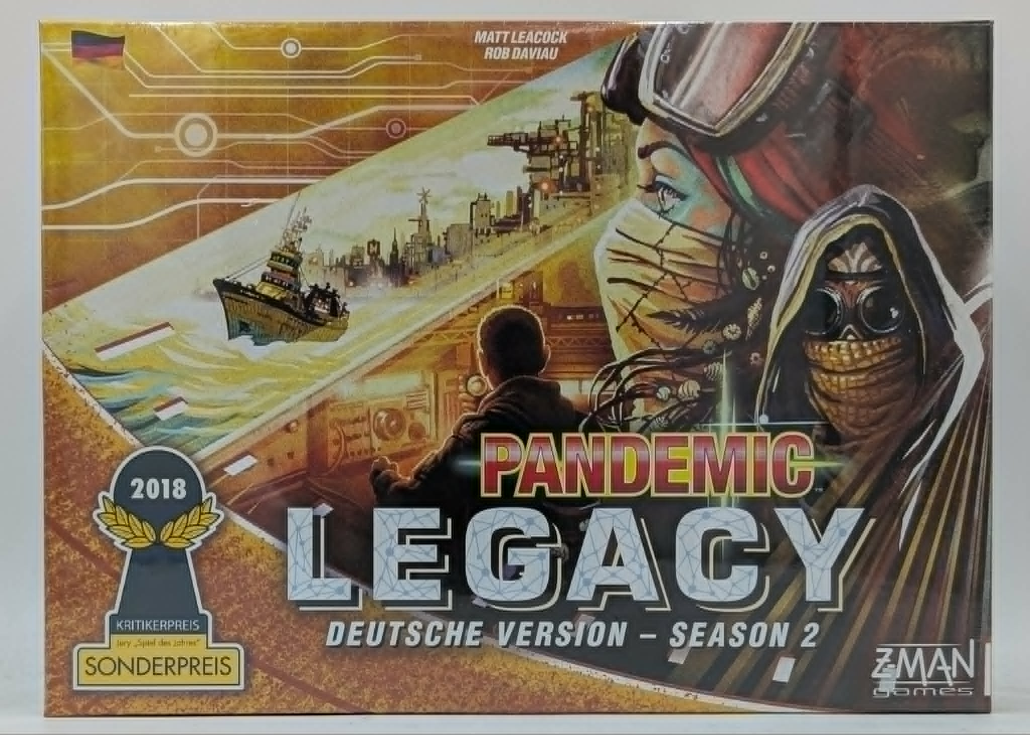 Pandemic Legacy Season 2 Brettspielbox mit postapokalyptischer Kunst und deutschem Sonderpreis-Abzeichen.