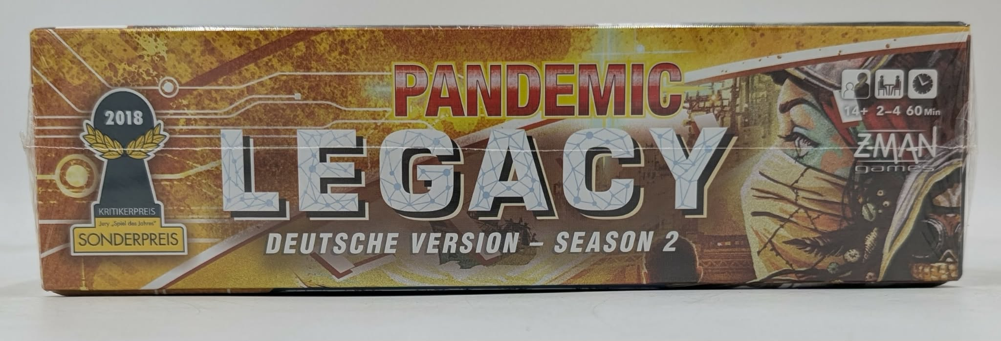 Pandemic Legacy Season 2 deutsches Brettspiel mit Titel, 2018er Auszeichnung und Z-Man Games Logo.