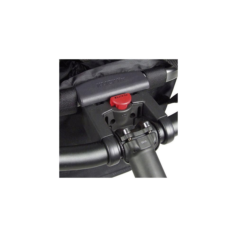Primer plano de un soporte de manillar de bicicleta negro con botón rojo Klickfix.
