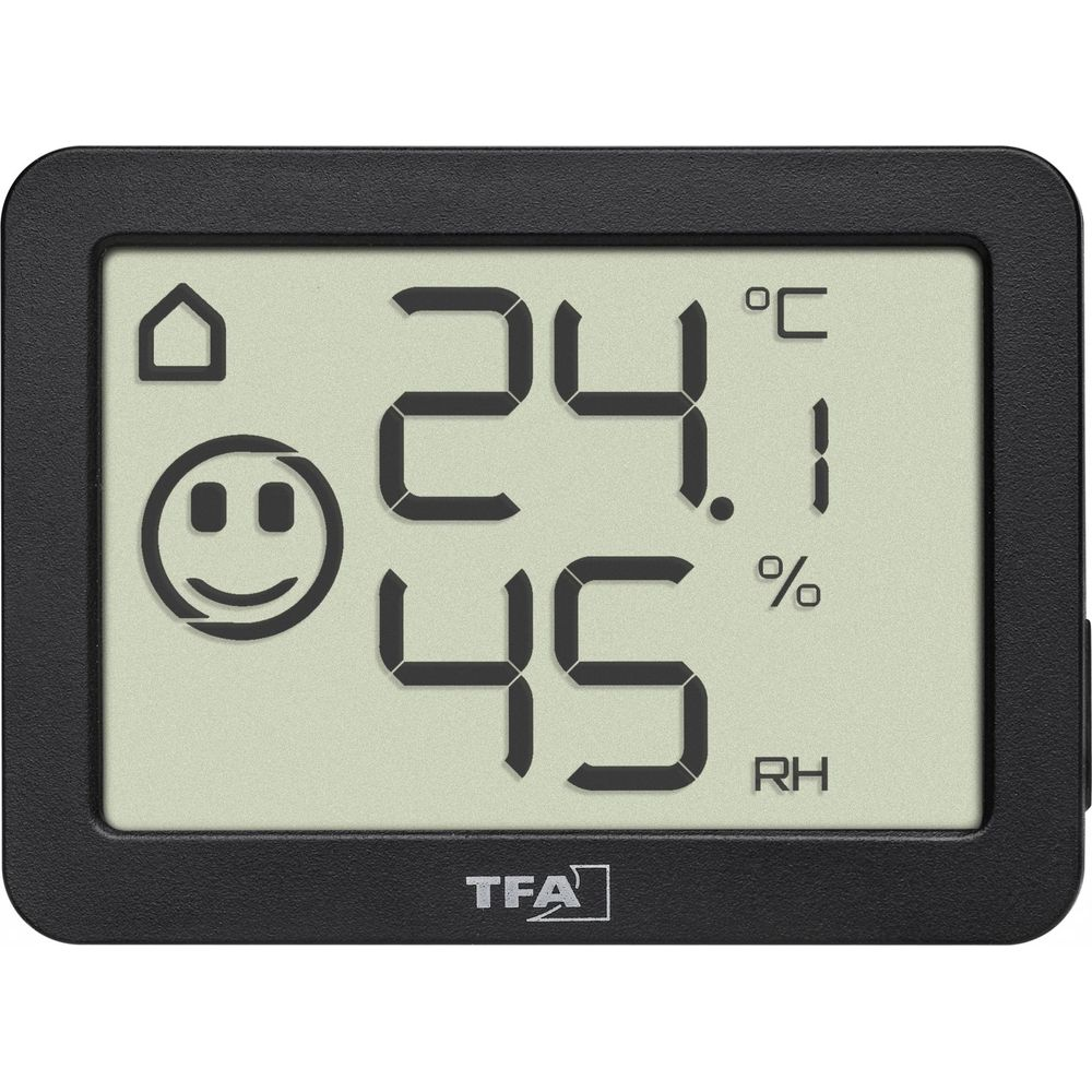 Ein schwarzes TFA-Thermo-Hygrometer zeigt 24.1 Grad Celsius und 45% Luftfeuchtigkeit mit einem Smiley.