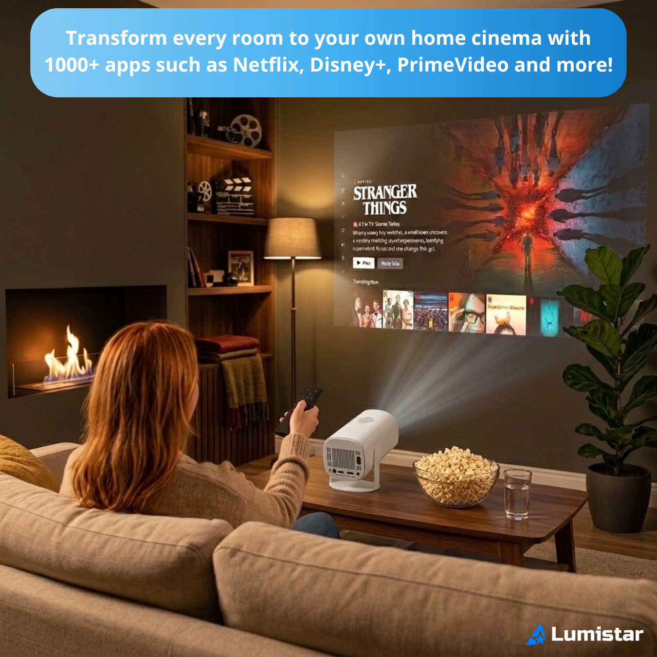 A woman sits on a sofa, projecting movies onto the wall using a home theater projector.
