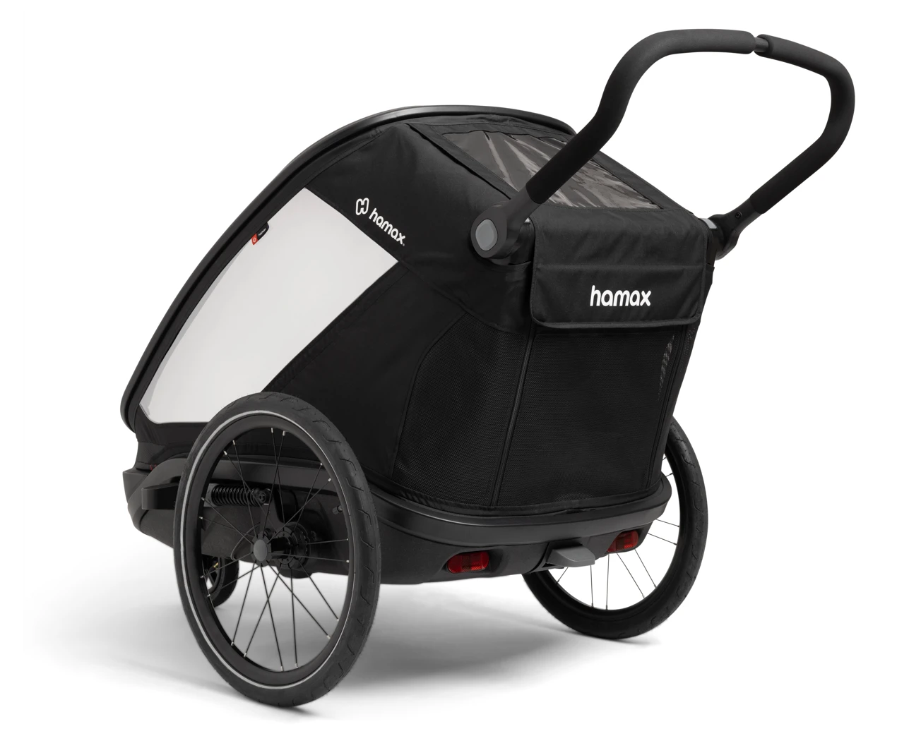 Un remolque de bicicleta Hamax negro con ruedas grandes y manillar ajustable sobre fondo blanco.