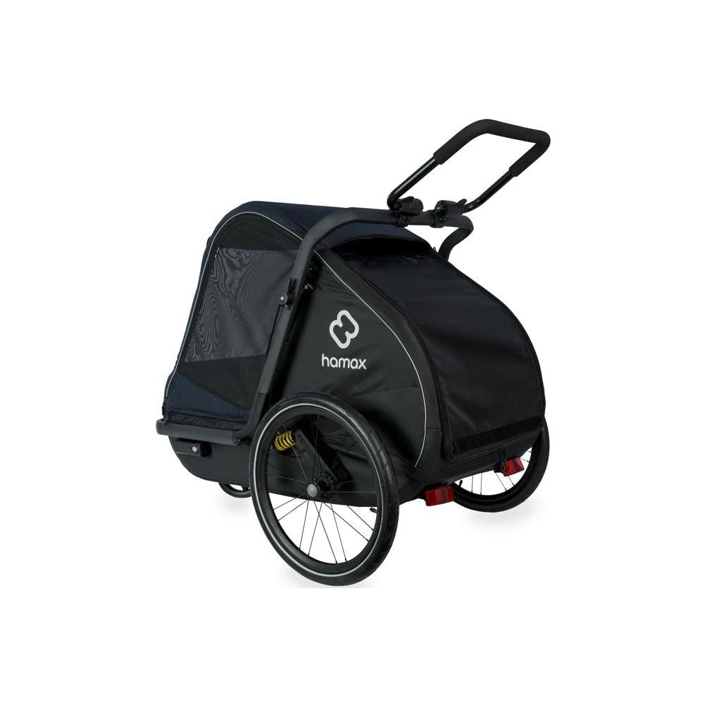 Un remolque de bicicleta infantil Hamax negro con ruedas y capota sobre fondo blanco.