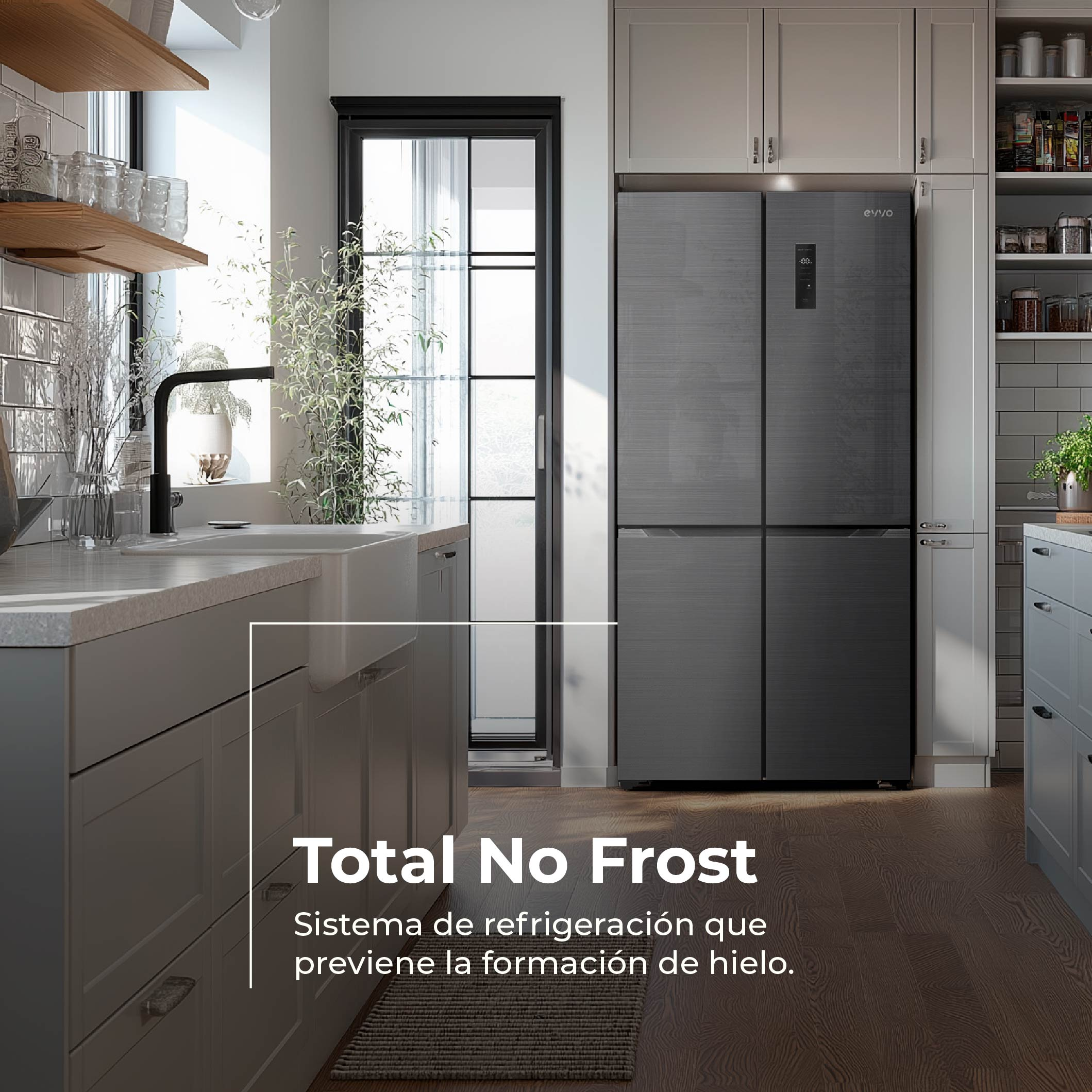 Cocina moderna con frigorífico gris oscuro, muebles grises, fregadero blanco y suelo de madera.
