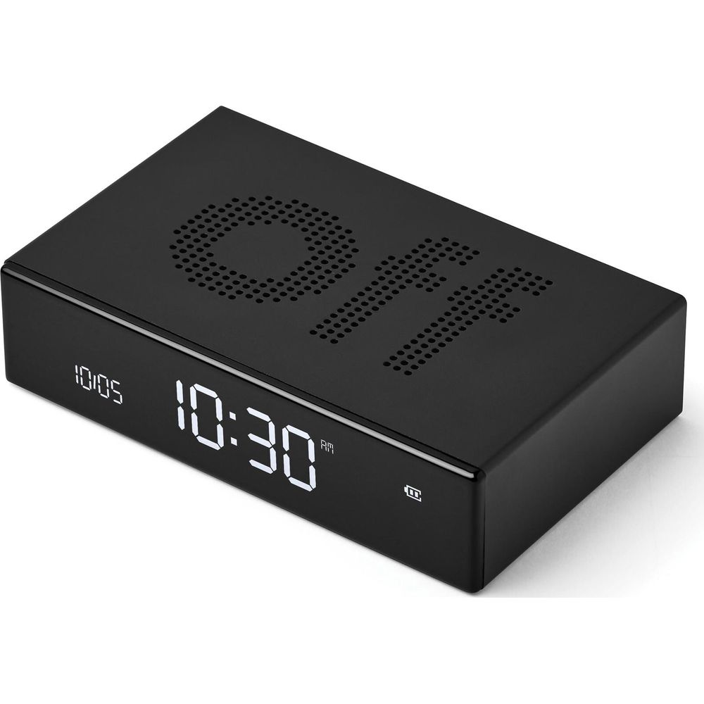 Eine schwarze rechteckige Digitaluhr auf weißer Oberfläche mit der Anzeige 10:30 auf dem LED-Bildschirm.