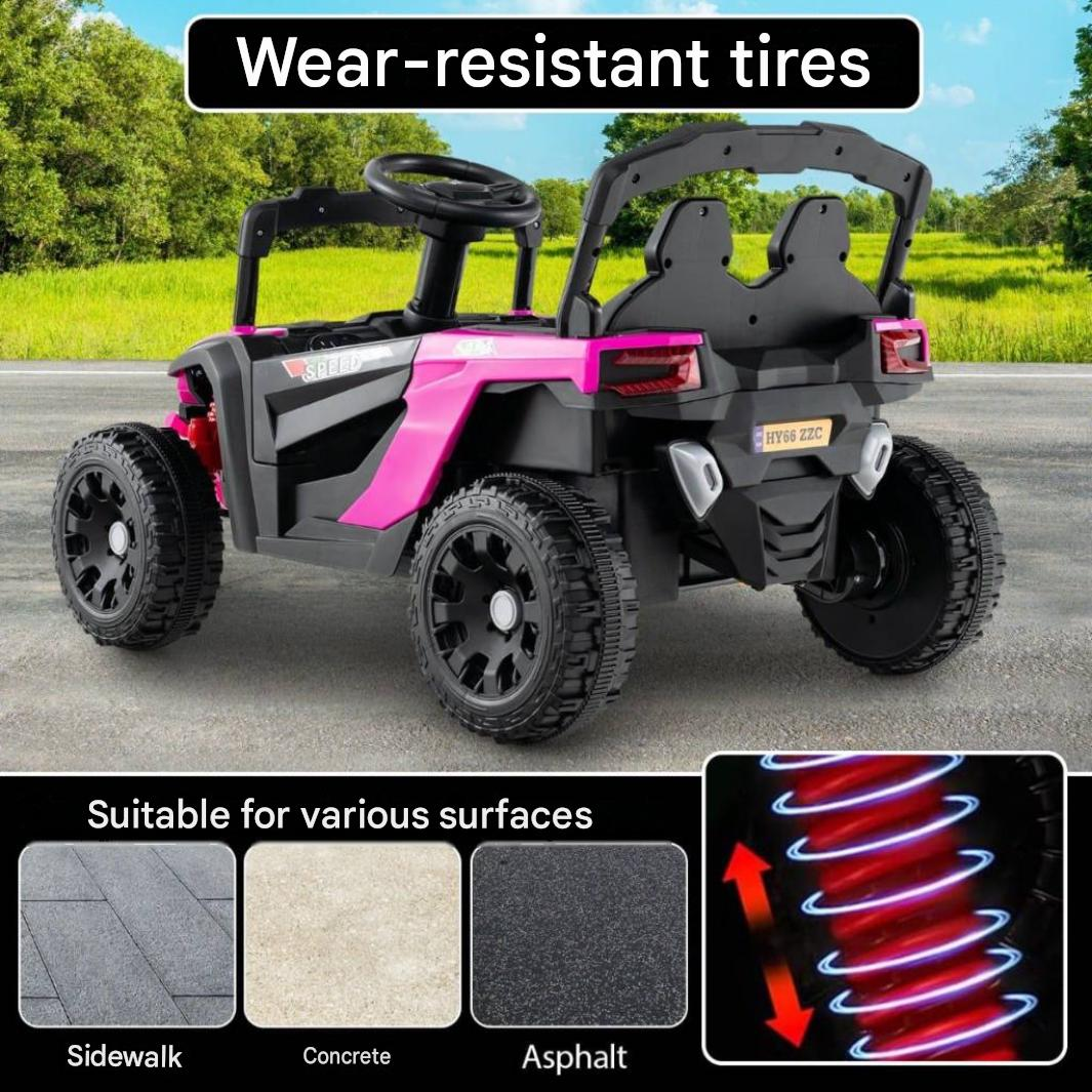 Une voiture électrique rose et noire pour enfants sur asphalte avec des textes sur les pneus et la suspension.