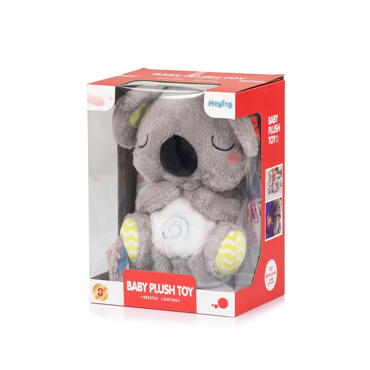 Ein graues Koala-Plüschtier in einer rot-weißen Verpackung mit geschlossenen Augen und gelb gemusterten Füßen.