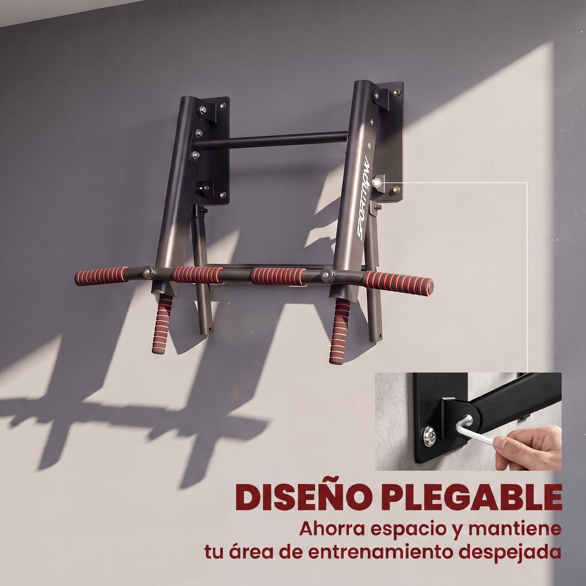 Barra de dominadas plegable montada en la pared en negro con agarres rojos y detalle de herramienta.