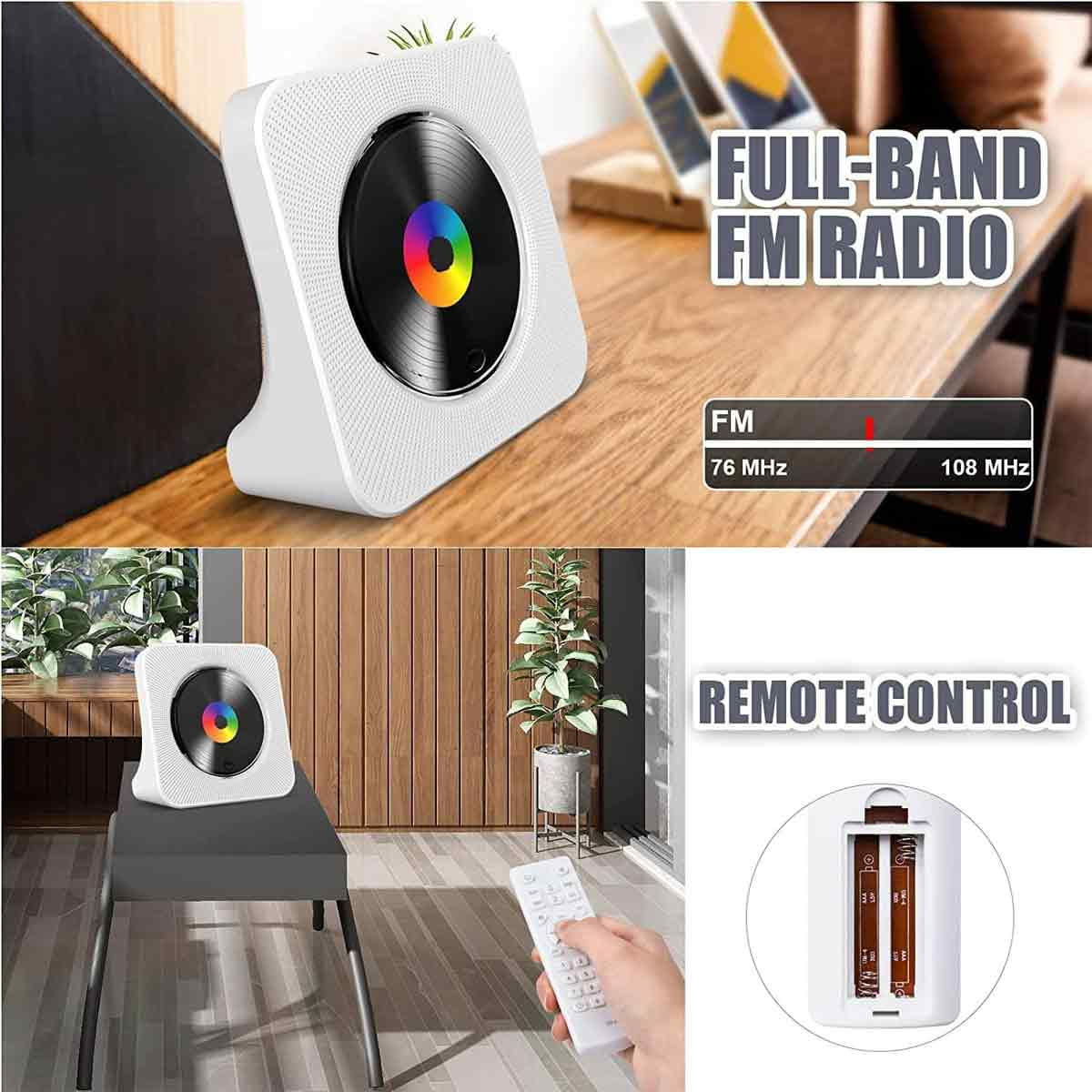 Ein weißer CD-Player mit buntem Zentrum auf einem Holztisch und eine Fernbedienung in einer Hand.