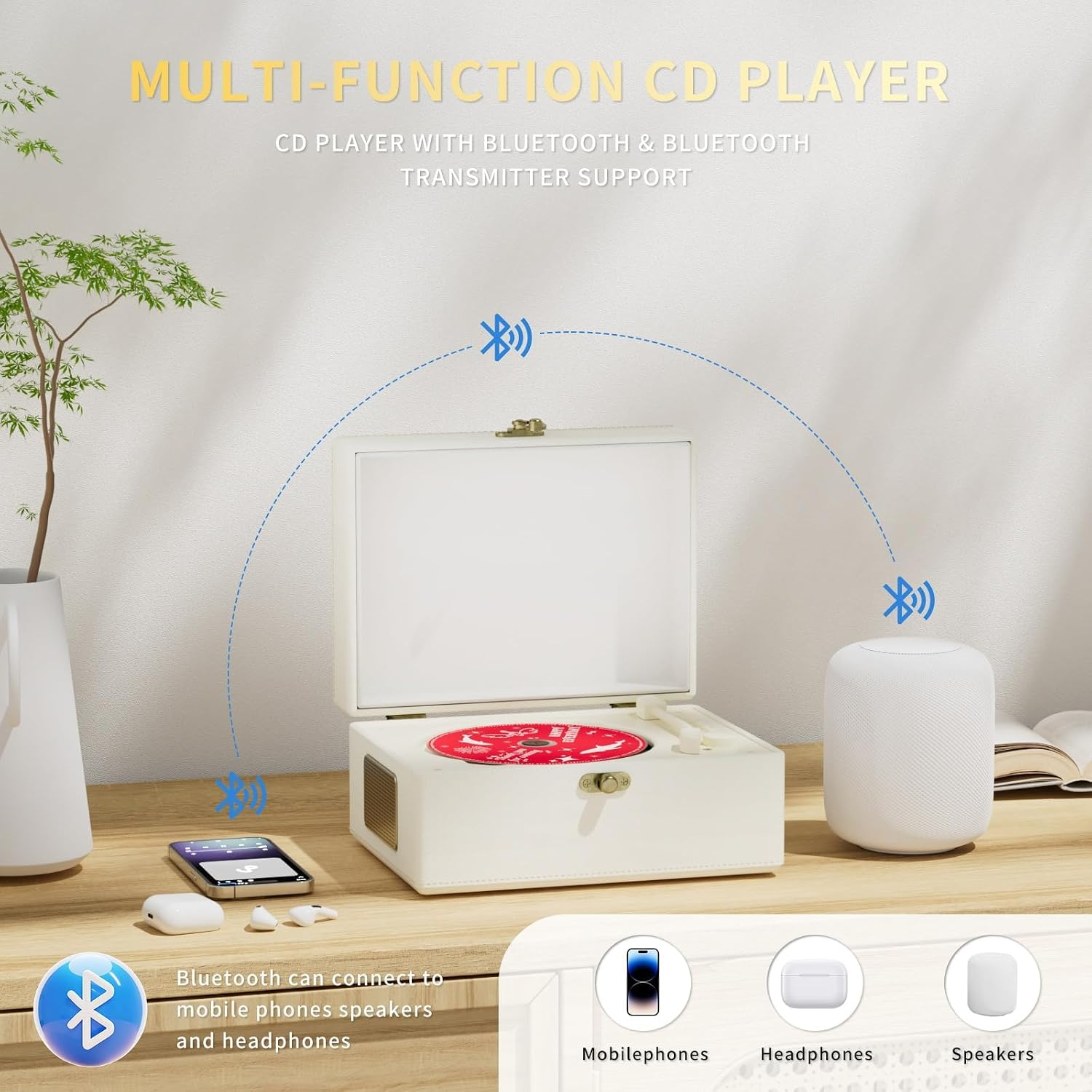 Weißer CD-Player auf Holztisch, verbunden via Bluetooth mit Smartphone, Kopfhörern und Lautsprecher.