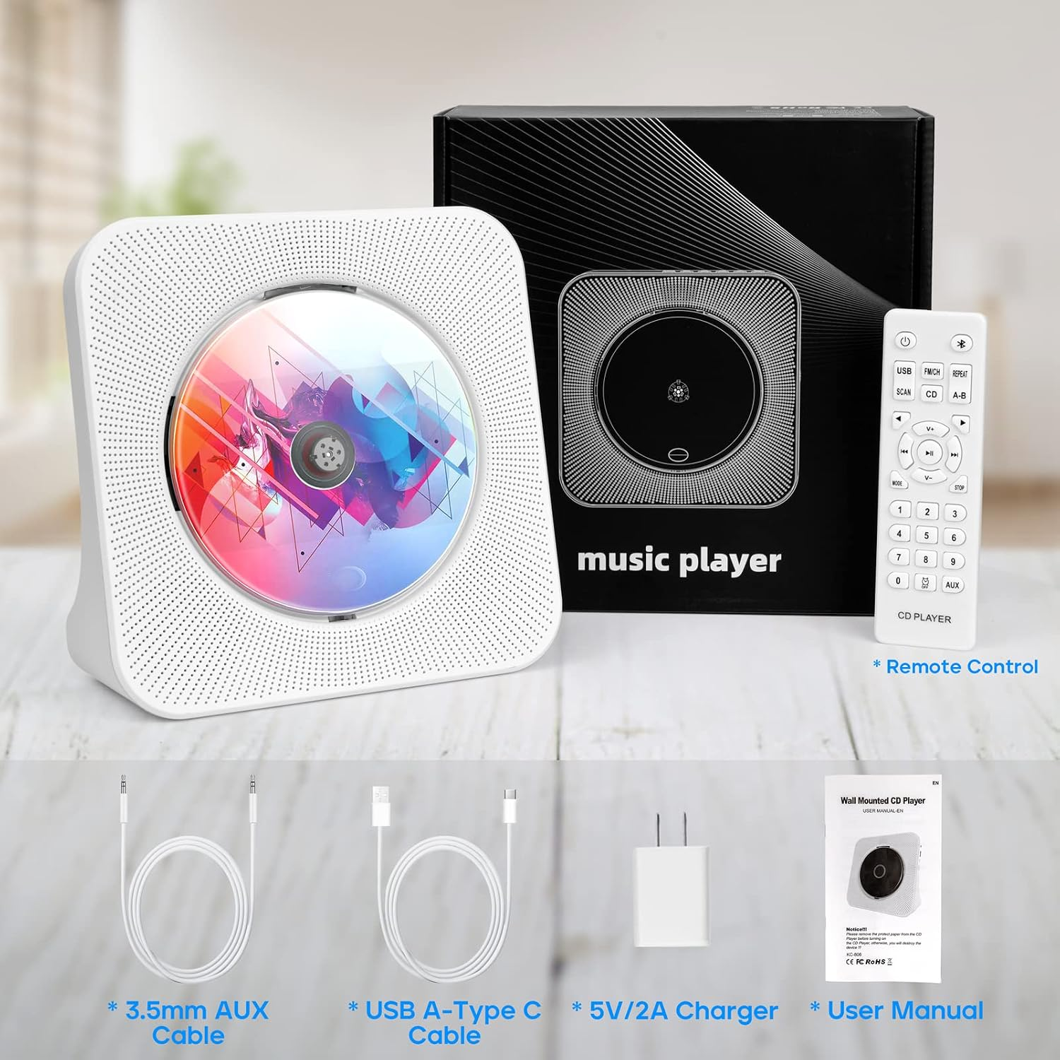 Weißer CD-Player mit bunter Disc, Verpackung, Fernbedienung, AUX- und USB-Kabel, Ladegerät und Handbuch.