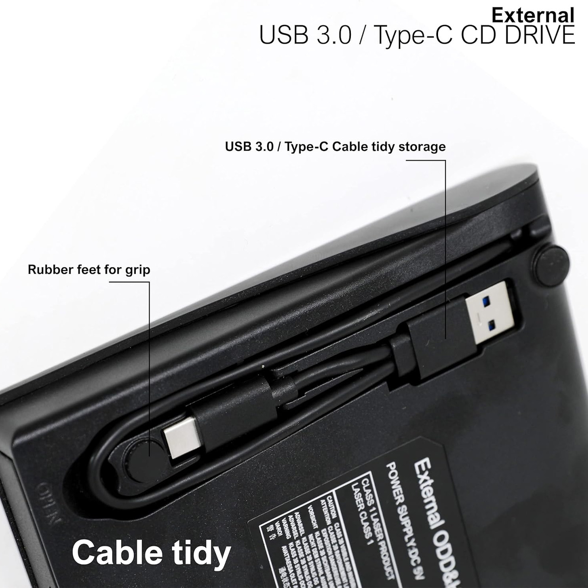 Unterseite eines schwarzen CD-Laufwerks mit integriertem USB-Kabel und Gummifüßen.