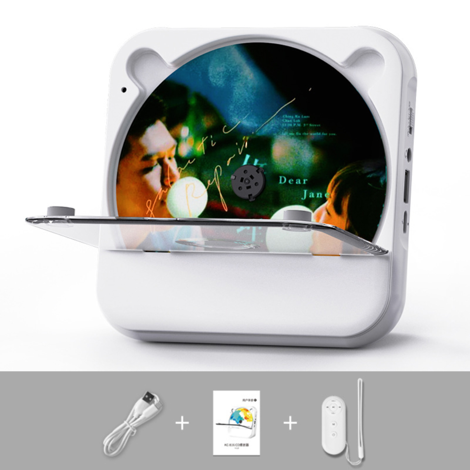 Ein weißer Wand-CD-Player mit offenem CD-Fach, dazu USB-Kabel, Handbuch und Fernbedienung.