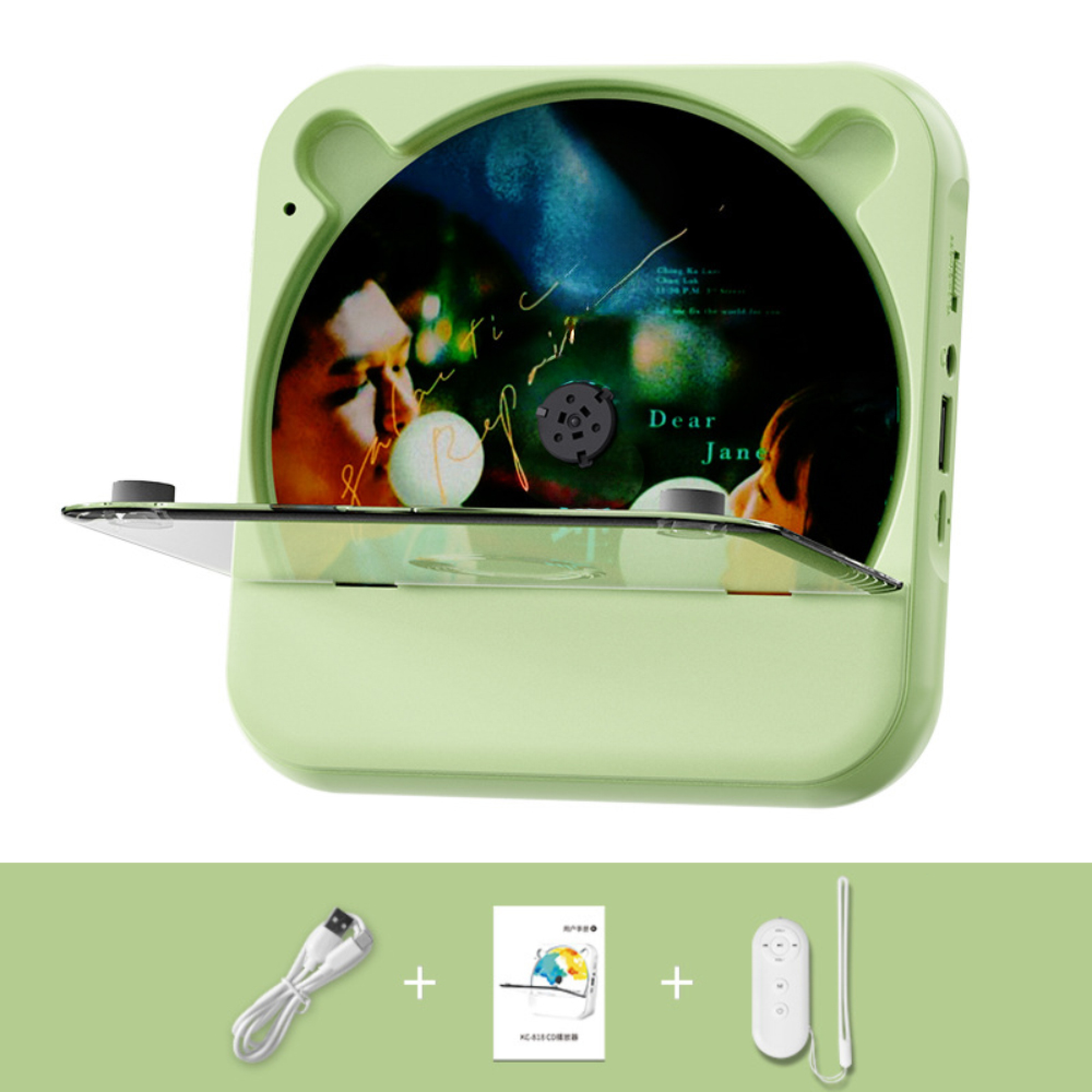 Grüner CD-Player mit eingelegter CD, USB-Kabel, Handbuch und weißer Fernbedienung.