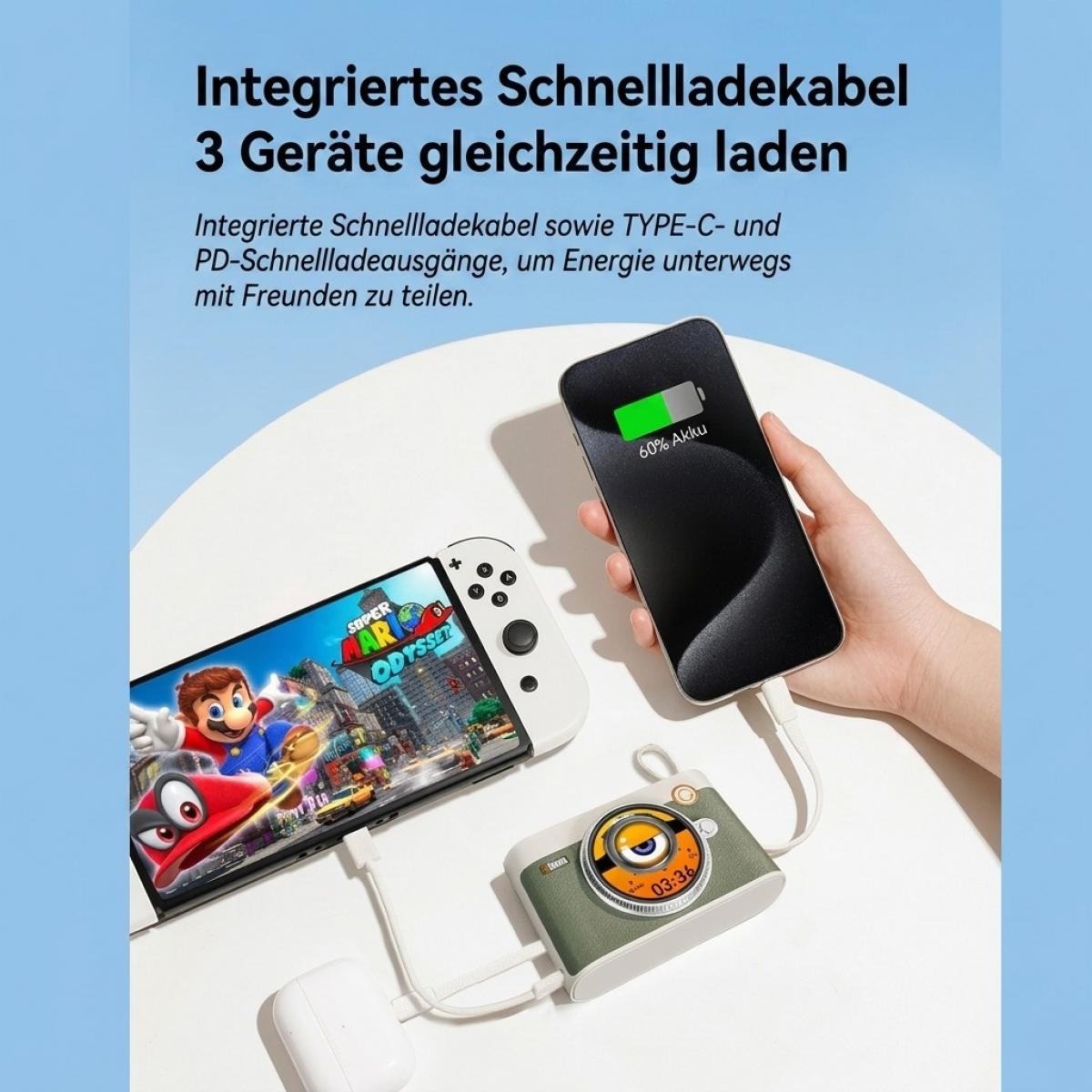 Eine Powerbank lädt gleichzeitig eine Konsole, ein Smartphone und Ohrhörer auf einem Tisch.