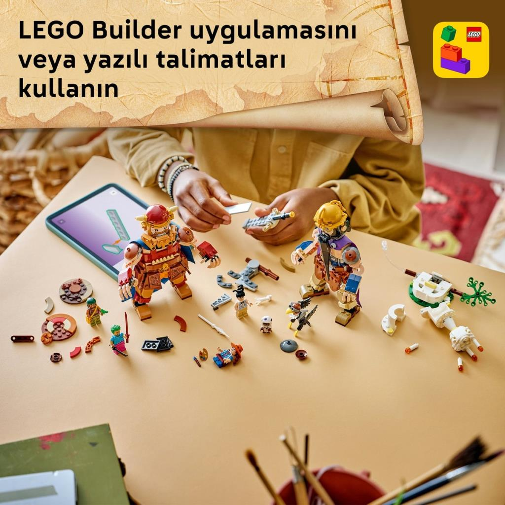 Una persona construye figuras vikingas de Lego en una mesa usando una tableta.