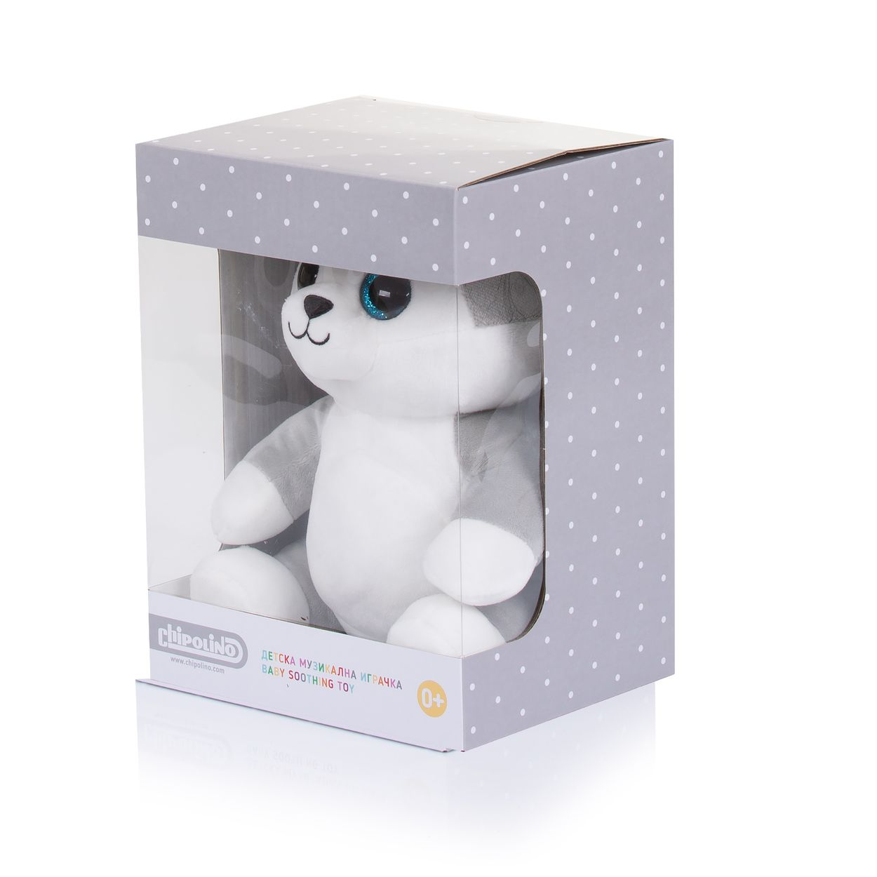 Ein Plüsch-Husky mit blauen Glitzeraugen in einer grauen Pünktchen-Geschenkbox mit transparentem Sichtfenster.