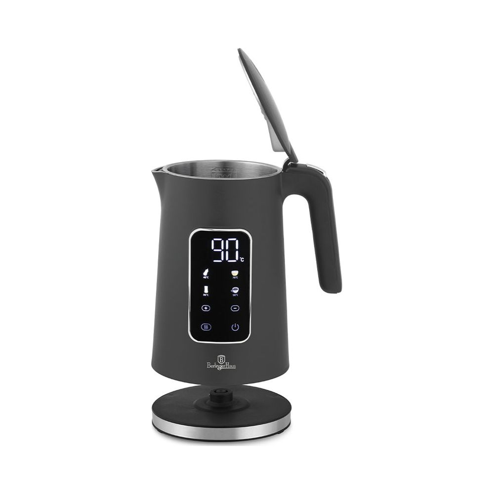 Un bollitore elettrico grigio con display digitale e coperchio aperto poggia su una base rotonda.