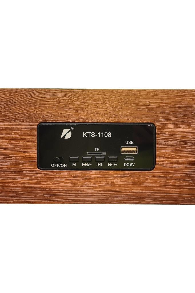 Ahşap doku üzerinde düğmeler, USB, TF kart yuvası ve güç anahtarı olan KTS-1108 kontrol paneli.
