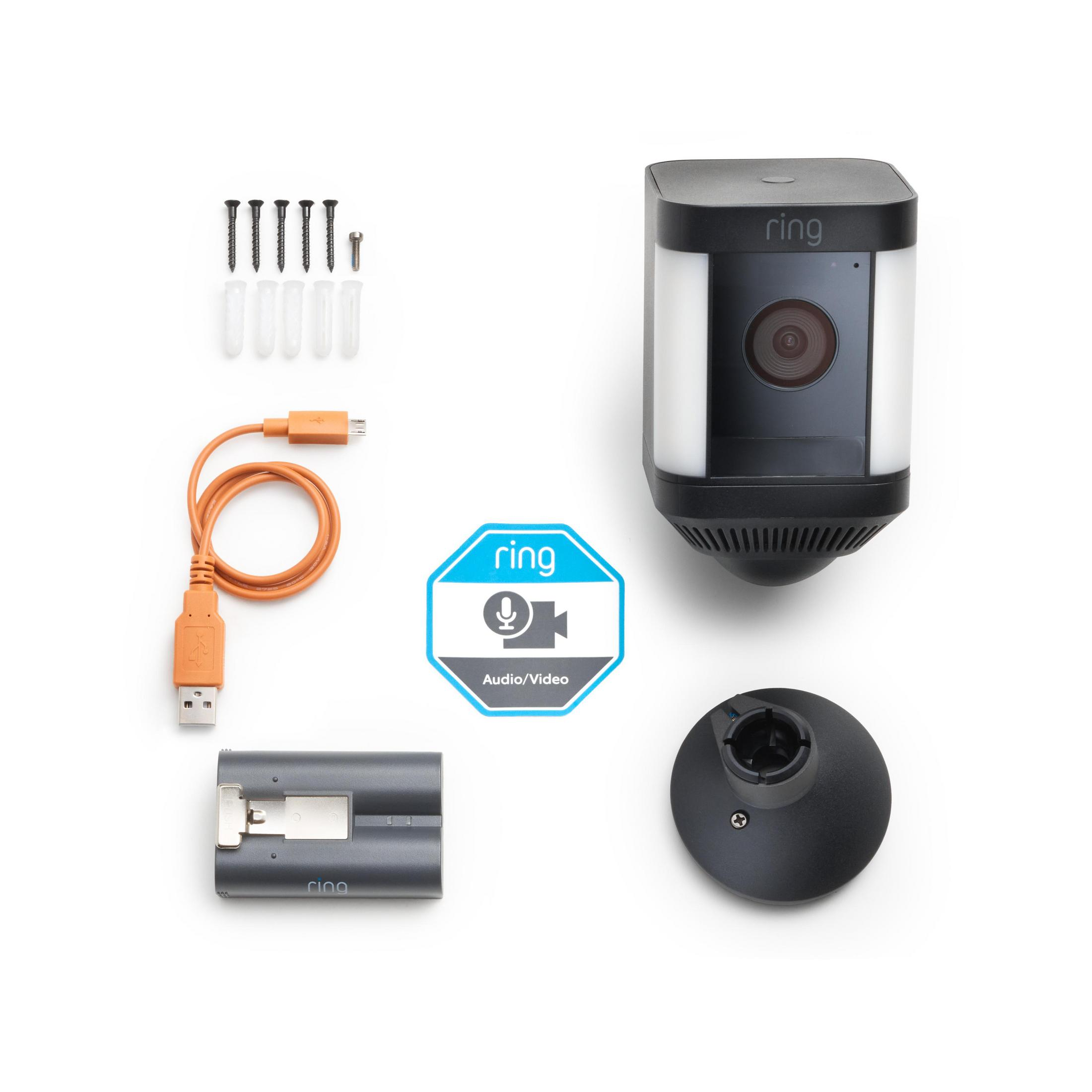 Cámara de seguridad Ring con batería, cable USB naranja, soporte, tornillos y pegatina.