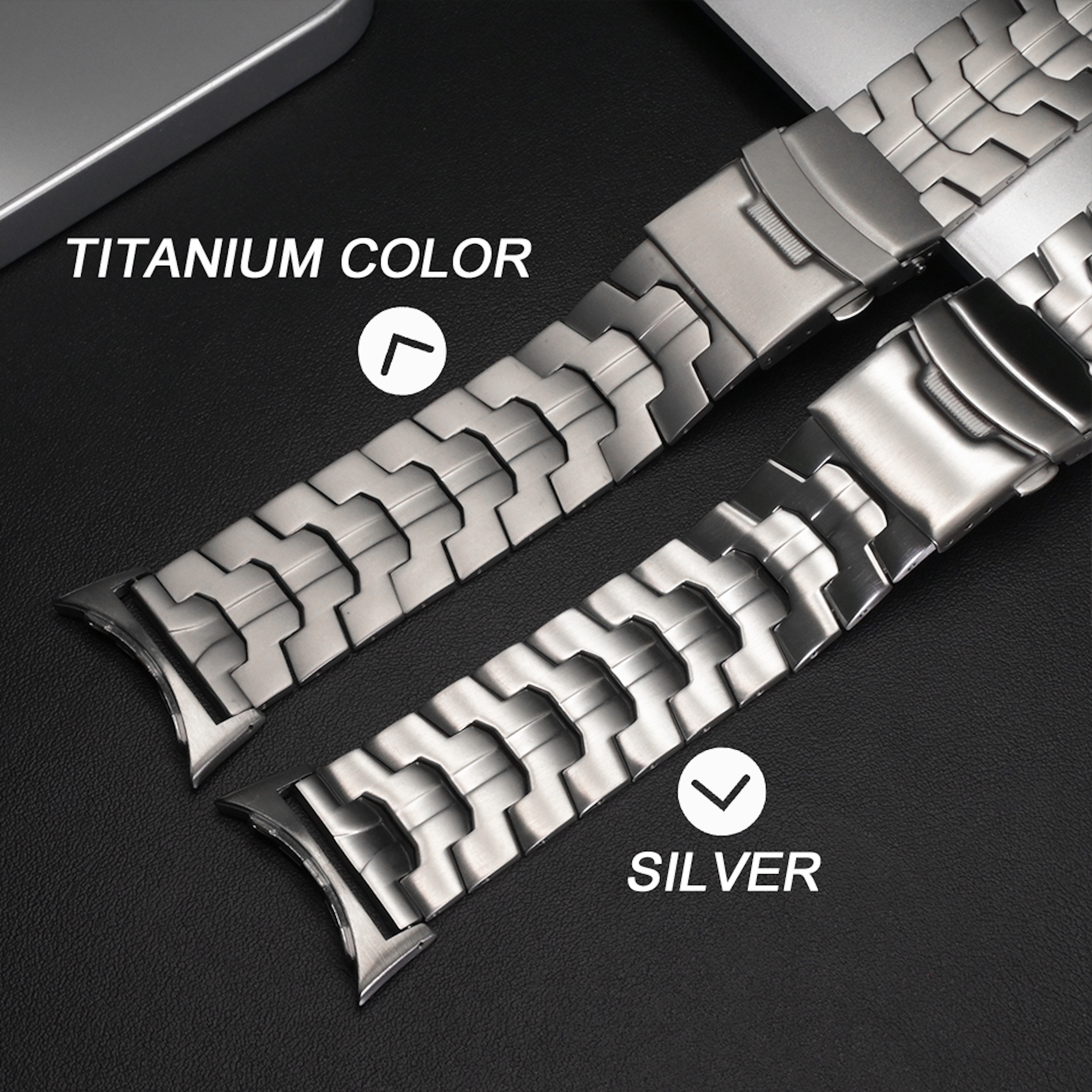 Vergleich von zwei Uhrenarmbändern in Titanfarbe und Silber auf dunklem Untergrund.