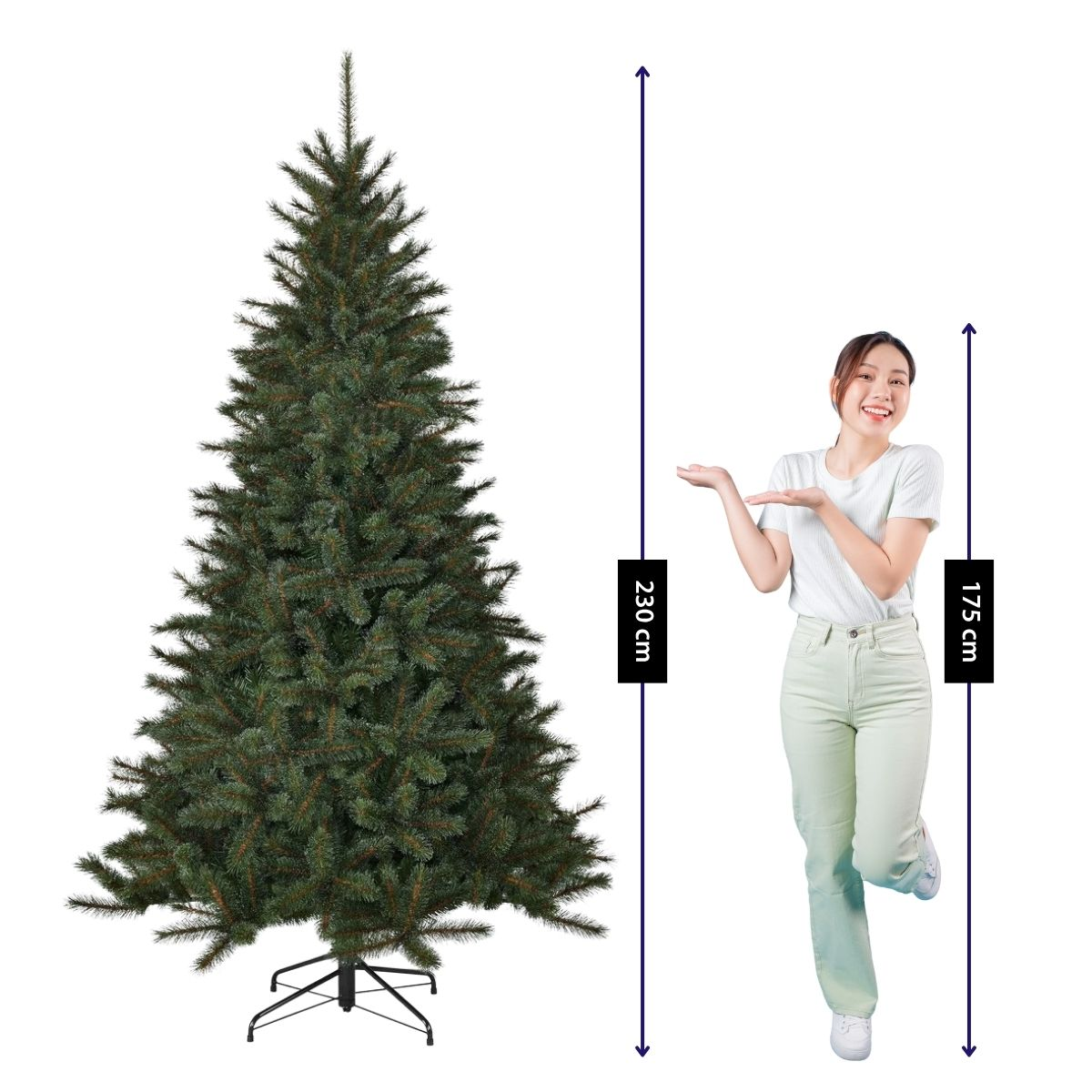 A woman next to a 230 cm tall artificial green Christmas tree with height indicators.