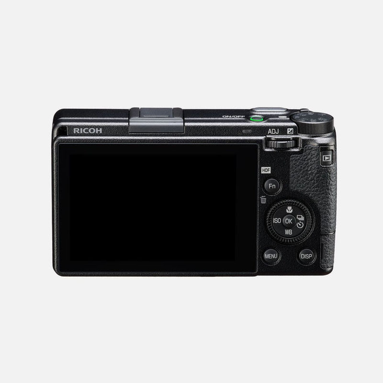 Vista posteriore di una fotocamera digitale Ricoh nera con display e pulsanti di controllo su sfondo chiaro.