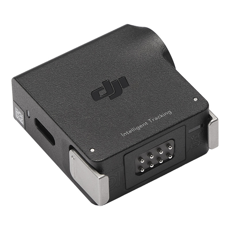 Modulo nero DJI Intelligent Tracking con pin di connessione e clip metalliche su sfondo bianco.
