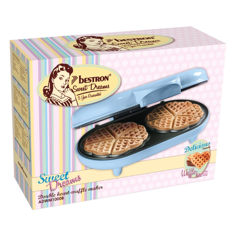 Ein pastellfarbener Waffelautomat mit zwei herzförmigen Waffeln auf einer bunten Verpackung.
