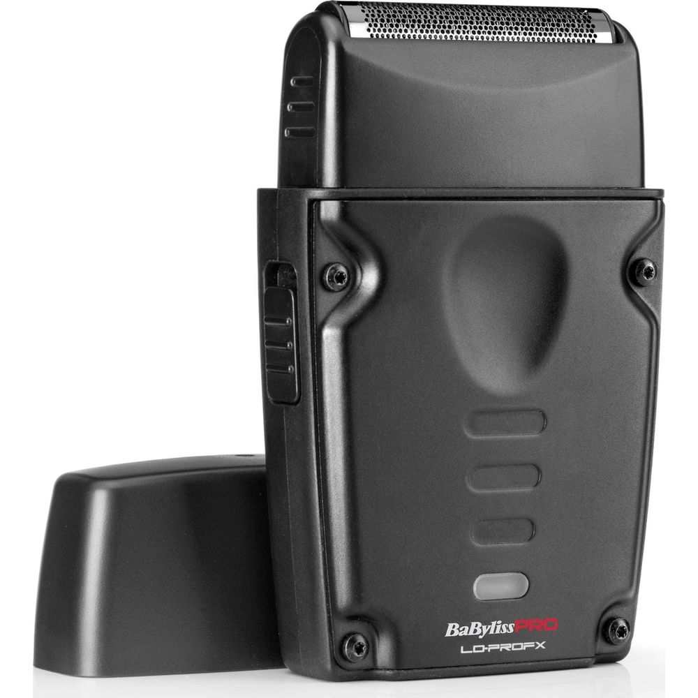 Un rasoio elettrico nero BaBylissPRO LO-PROFX con cappuccio rimovibile poggia su una superficie bianca.