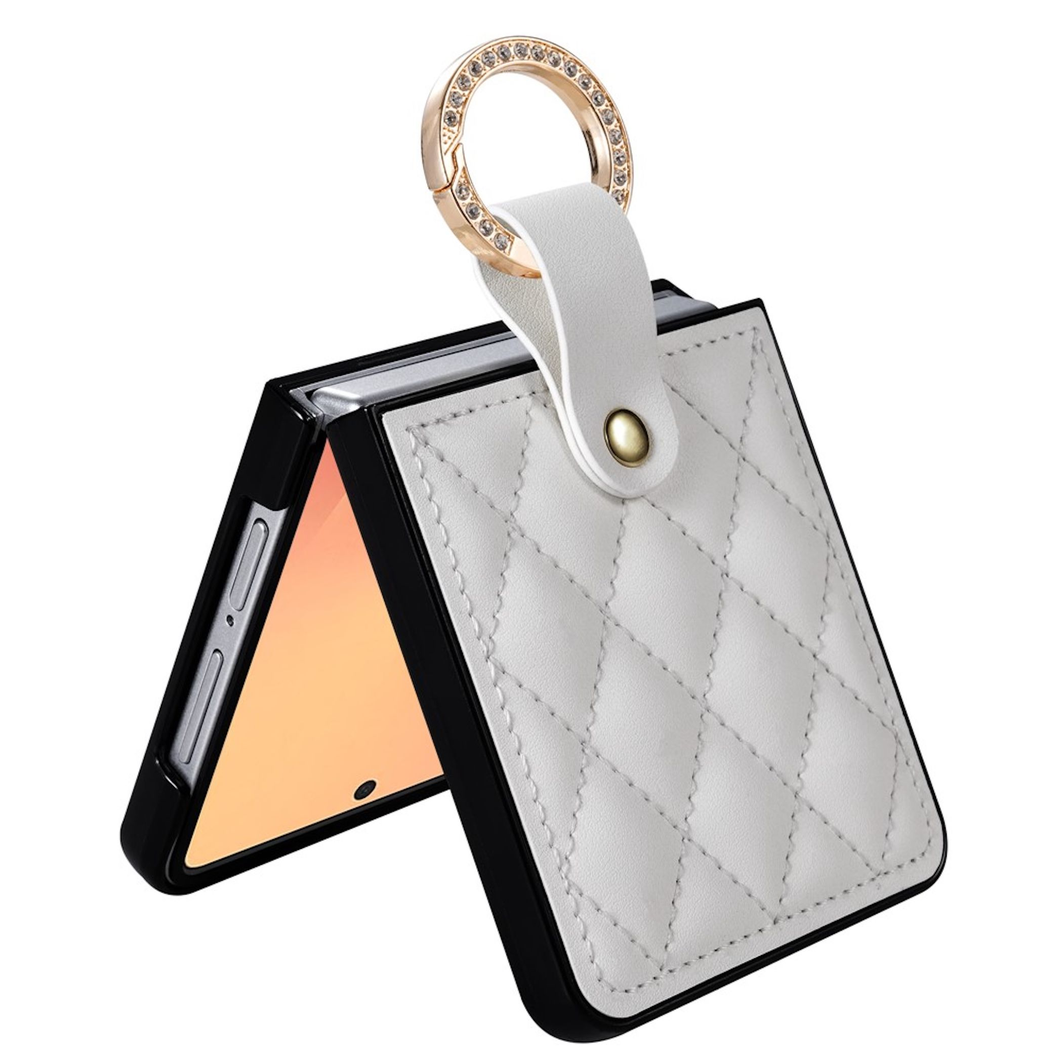 Eine gefaltete schwarze Handytasche mit weißem Rautenmuster und einem glitzernden goldenen Ring.