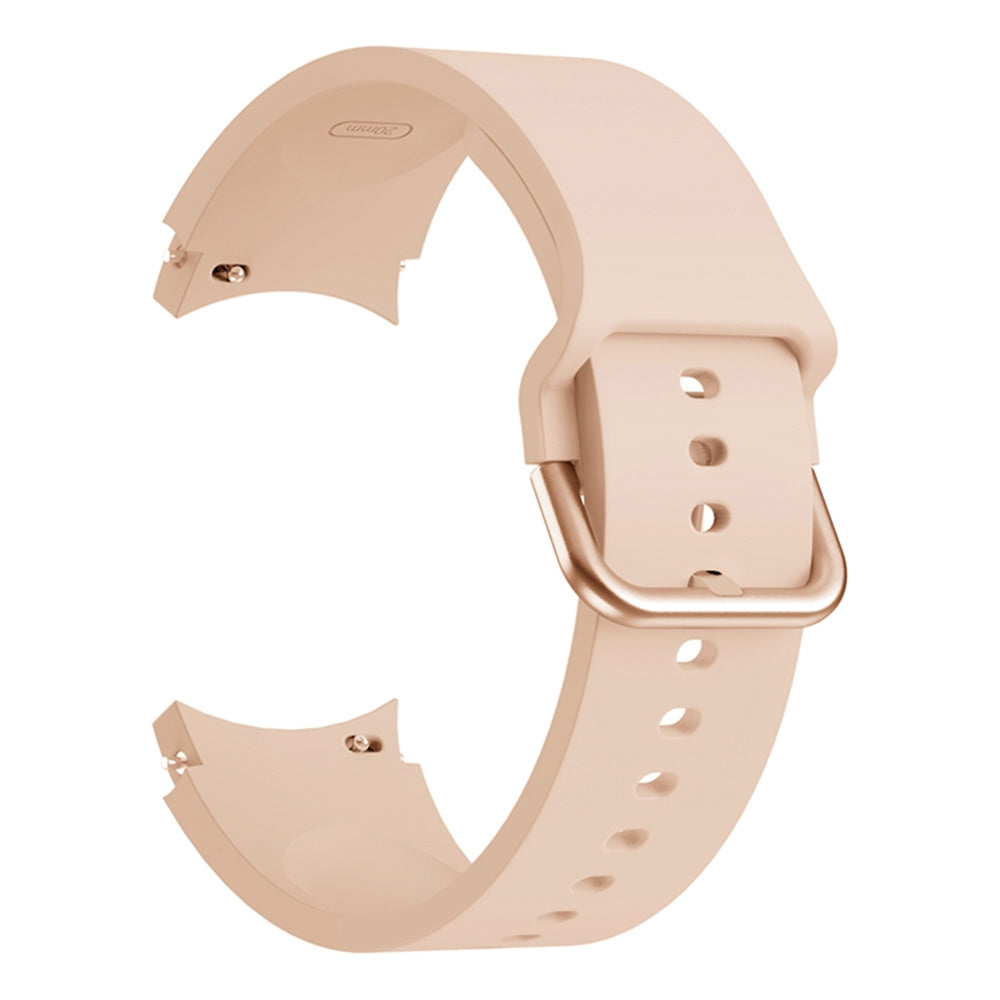 Un cinturino per orologio in silicone rosa con fibbia in metallo abbinata su sfondo bianco.