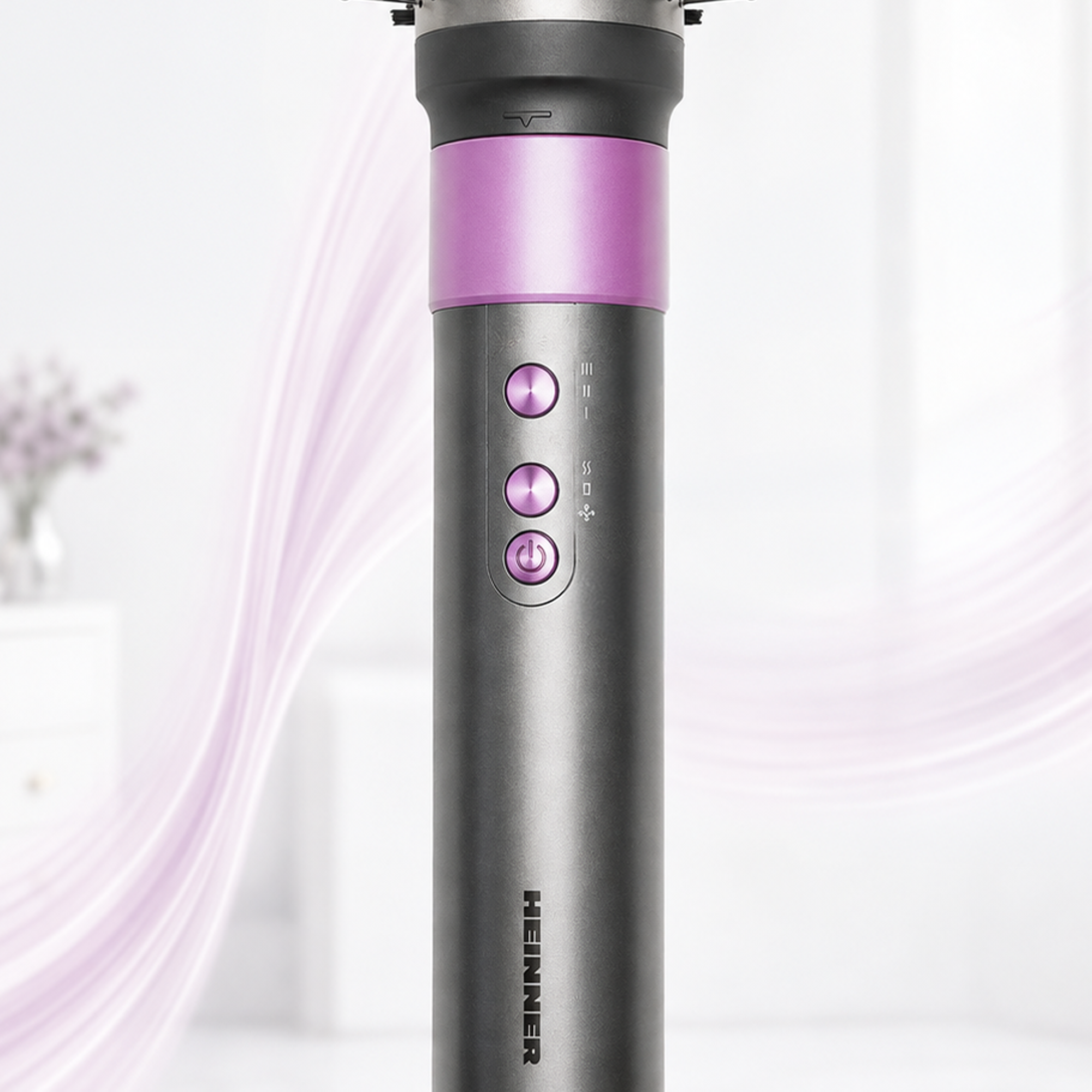 Grauer Haartrockner mit violetten Tasten und Ring in einem hellen Raum.