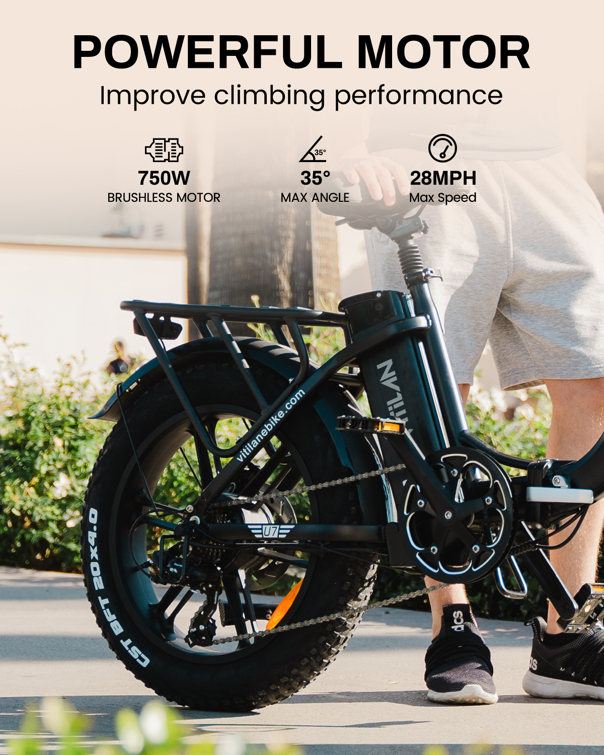 Una bicicleta eléctrica negra con motor de 750W, ángulo de subida de 35° y velocidad máxima de 28MPH.