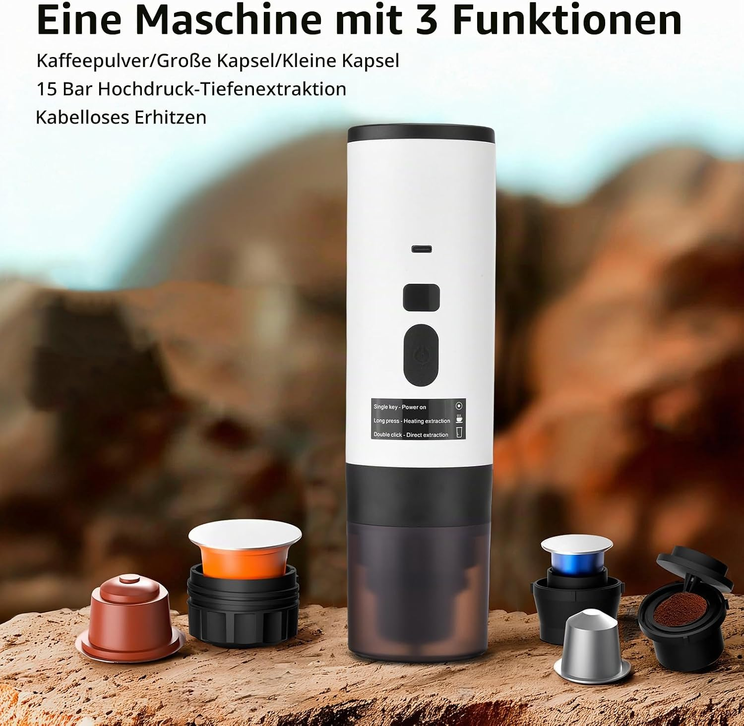 Eine tragbare weiße Kaffeemaschine mit Kapseln und Kaffeepulver auf einem felsigen Hintergrund.