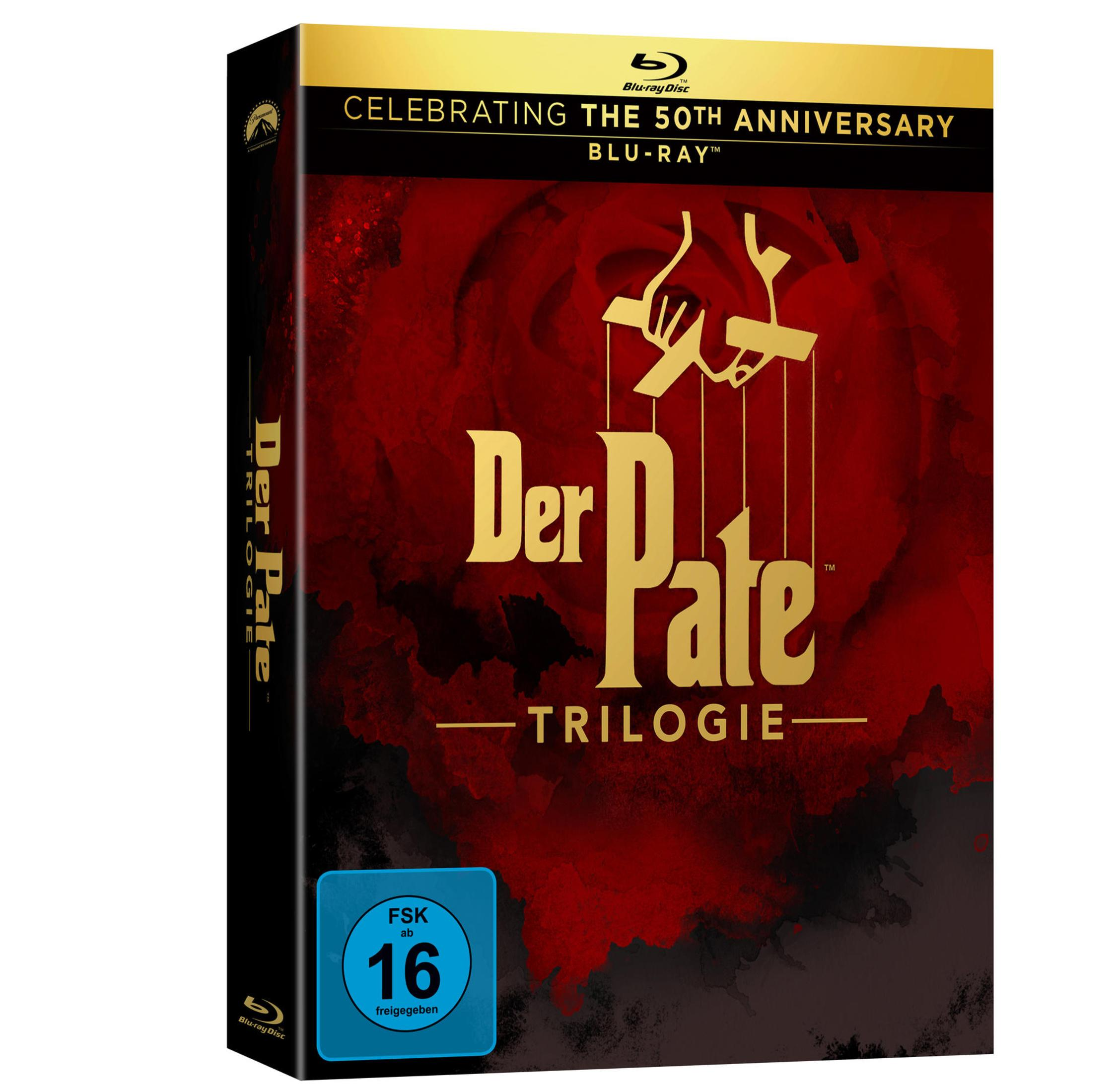 Blu-ray-Hülle von Der Pate Trilogie mit rotem Hintergrund, goldenem Schriftzug und FSK-16-Logo.